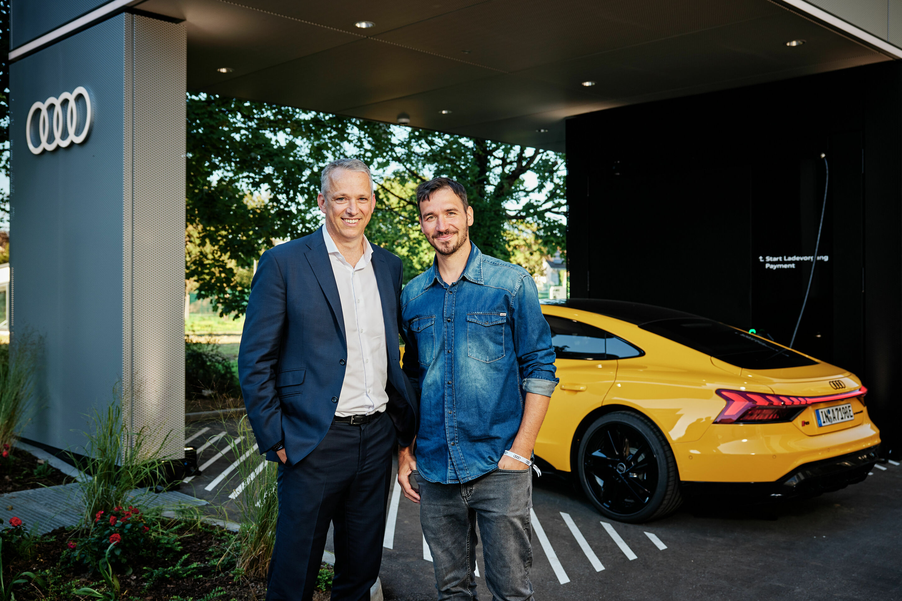 New Audi charging hub opens in Munich - Fast charging with Audi in Munich: Philipp Noack, Head of Sales Germany (left) with brand ambassador Felix Neureuther at the opening of the Audi charging hub in Munich's Obersendling district.