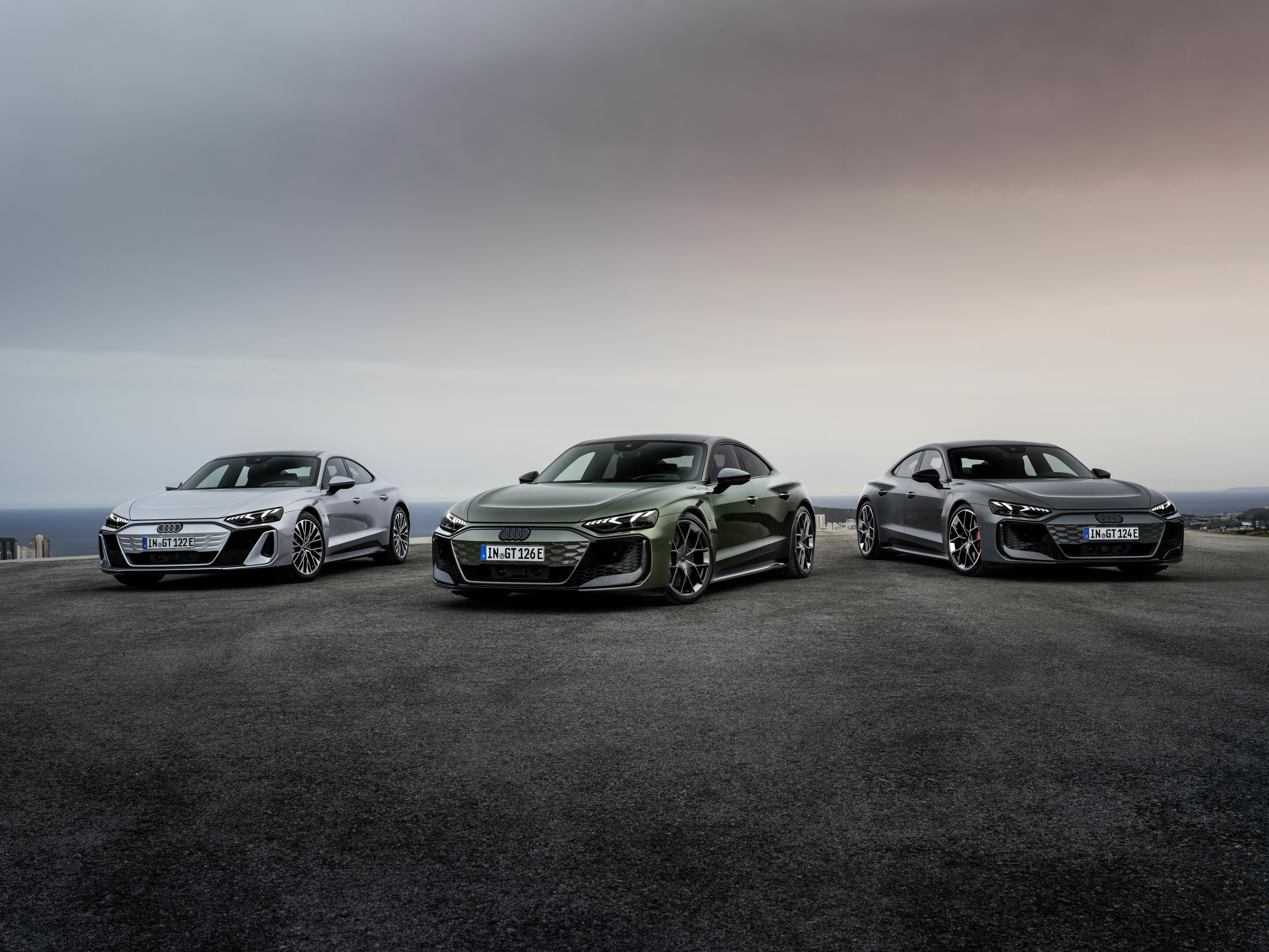 The new Audi e-tron GT model family - Static photo,
Audi S e-tron GT, Colour: Florett silver metallic; Audi RS e-tron GT, Colour: Nimbus grey perl effect; Audi RS e-tron GT performance, Colour: Bedford green metallic